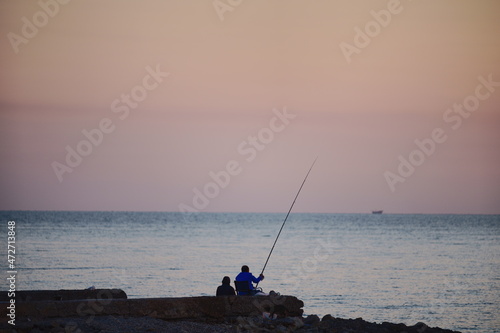 Sunrise and fishing on the beach