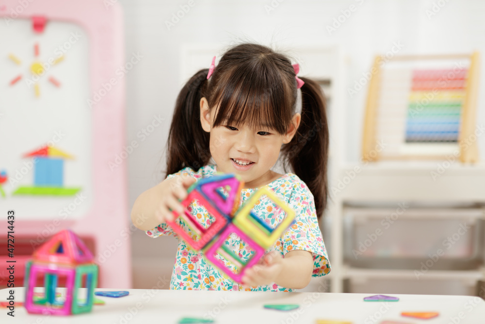 Young Girl Playing Creative 3D Shape Toy For Homeschooling Young Girl Playing Creative 3D Shape Toy For Homeschooling