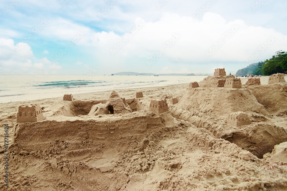 Large sand castle on the sea beach.