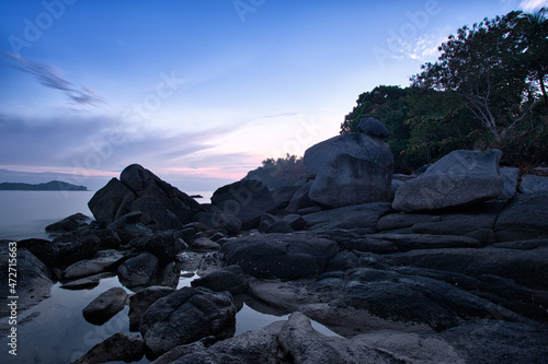Big rocks and stones at the sea beach on daybreak.