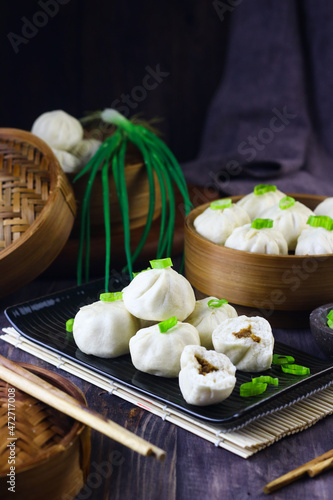 Photography Bakpao Ayam or Chicken steamed buns on bamboo steamer
