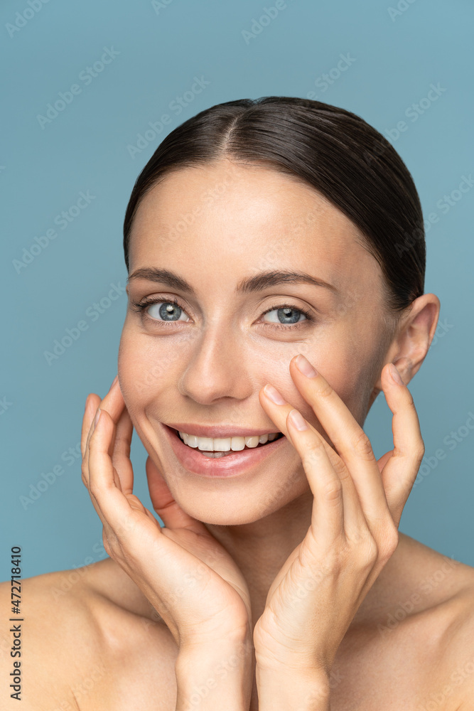 Young woman with glowing healthy skin touch fresh face after skincare professional treatment nourishment in beauty spa center. Closeup of female face with perfect skin. Makeup and cosmetics concept Young woman with glowing healthy skin touch fresh face after skincare professional treatment nourishment in beauty spa center. Closeup of female face with perfect skin. Makeup and cosmetics concept