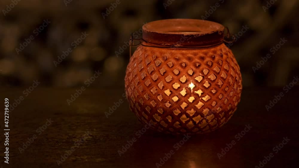Lantern with candlelight on a table. Romantic and vintage. Lantern with candlelight on a table. Romantic and vintage.