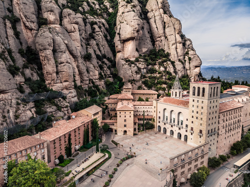 Drone shot of Mount Montserrat. Drone view of the famous Montserrat monastery. Mountain shelter of Benedictine monks. The jagged mountains of Spain. Mountain landscape. Mountain trails.