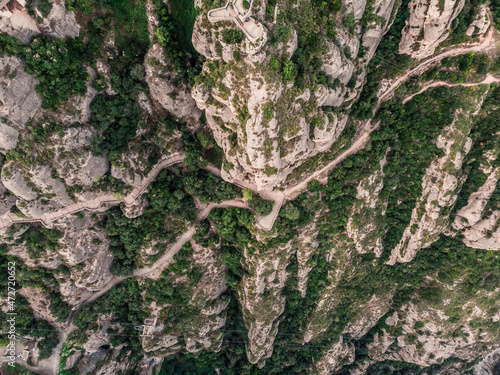 Drone view of Montserrat mountain. The jagged mountains of Spain. Mountain landscape. Mountain trails. Sacred mountain and monastery of Montserrat. Rocky ledge.
