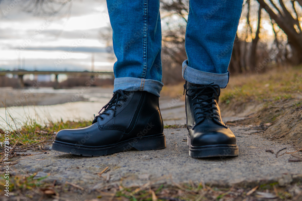 men's feet in winter leather boots