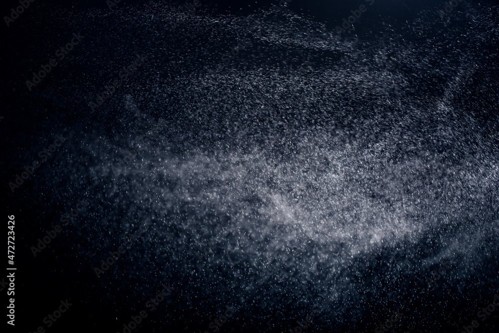 Obraz premium texture of falling snow, layer to overlay on a black background