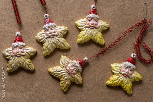 grungy santa star ornaments on plain brown paper photo