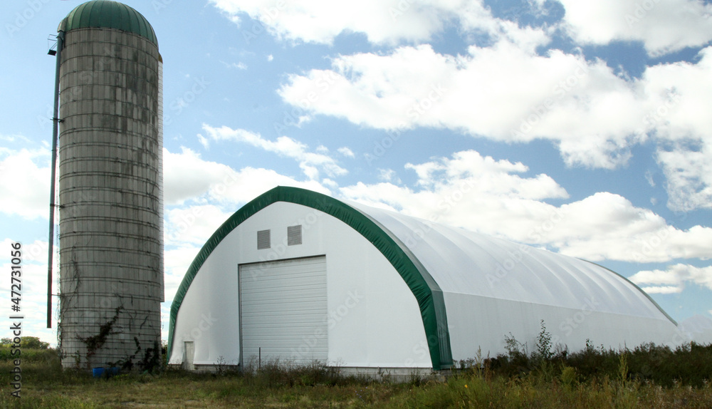 Hay storage and equipment building with silo