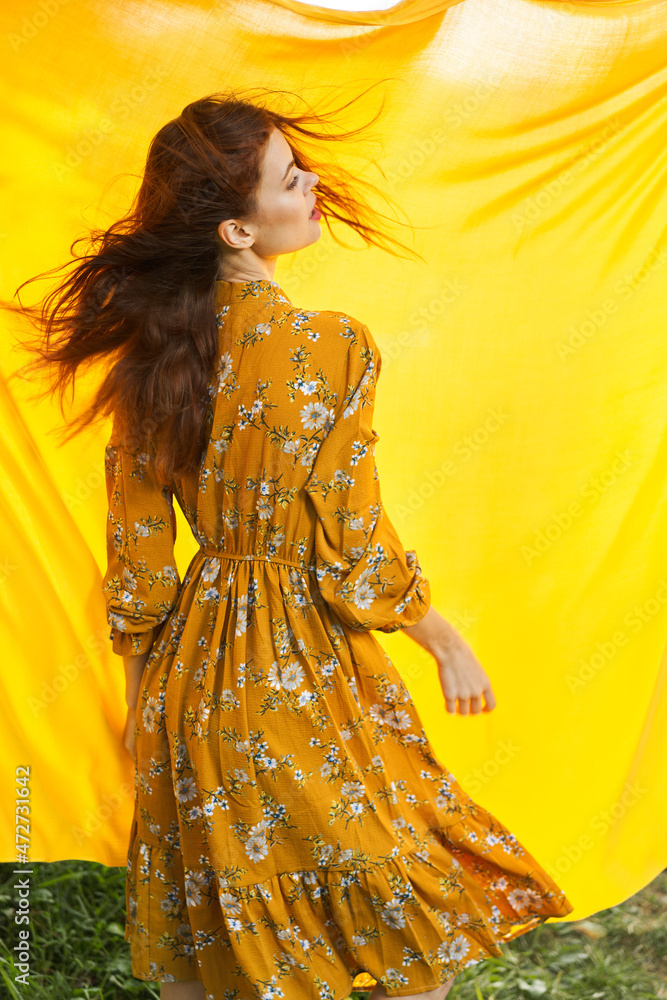woman in dress posing nature yellow cloth fresh air