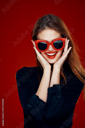 Wallpaper Mural pretty woman wearing sunglasses fashion posing hairstyle red background Torontodigital.ca