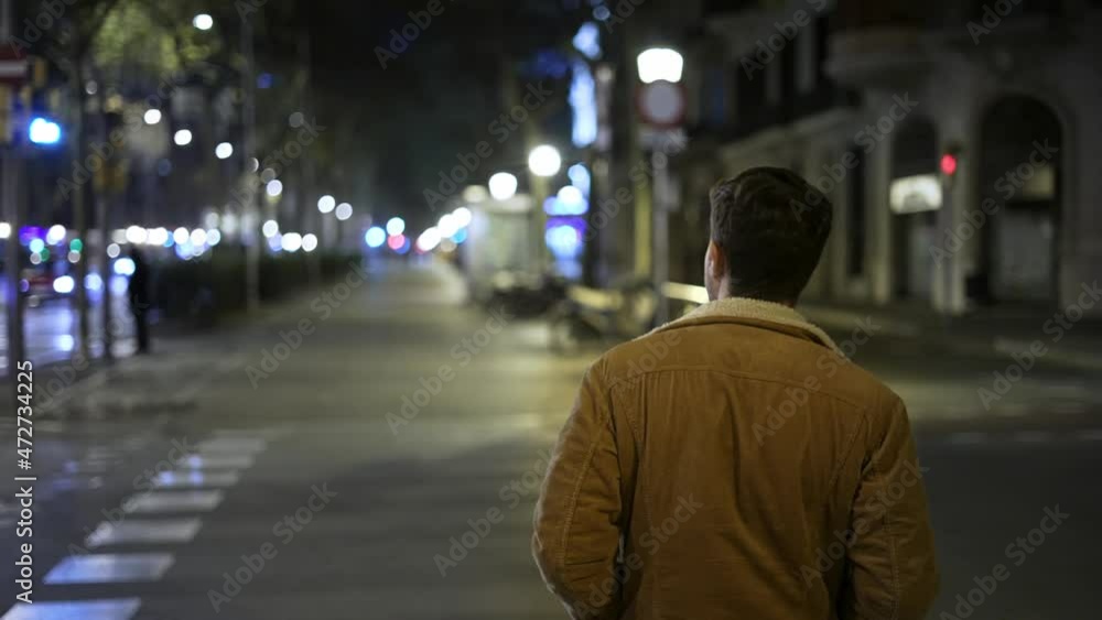Man starting to cross road at night Man starting to cross road at night