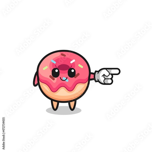 doughnut mascot with pointing right gesture