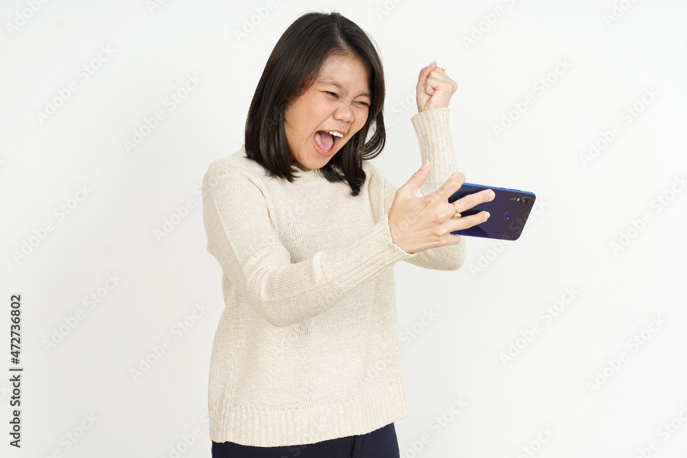 Playing Mobile Game on smartphone of Beautiful Asian Woman Isolated On White Background Playing Mobile Game on smartphone of Beautiful Asian Woman Isolated On White Background