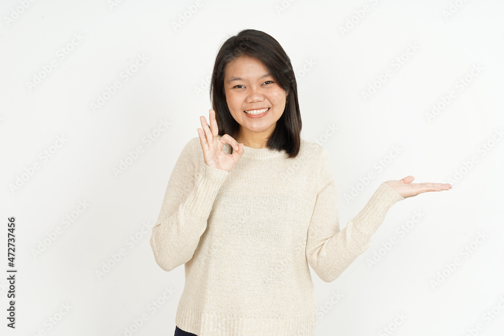 Showing recommended product on open palm of Beautiful Asian Woman Isolated On White Background Showing recommended product on open palm of Beautiful Asian Woman Isolated On White Background