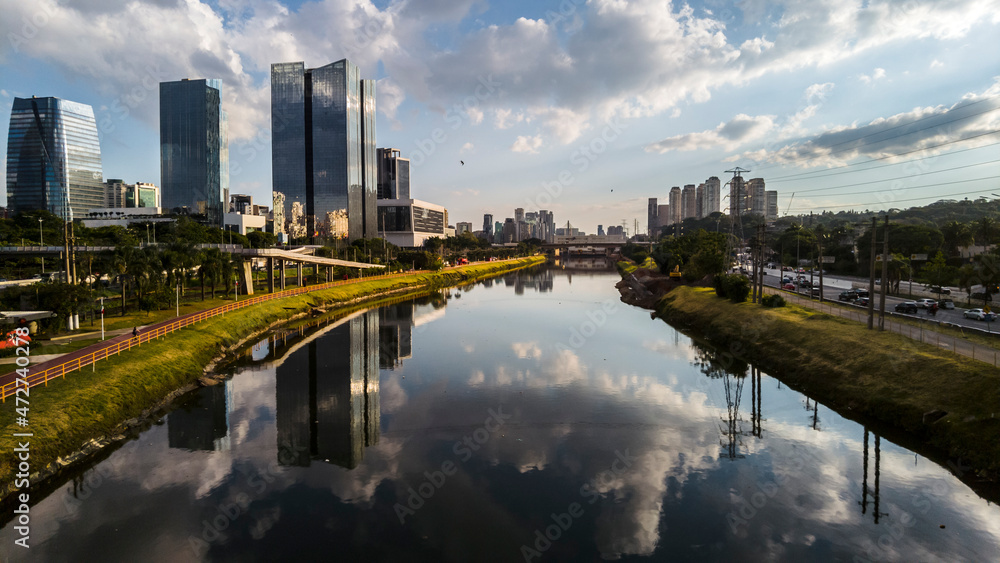 Naklejka premium Modern office buildings and Pinheiros River in Sao Paulo city, Brazil.