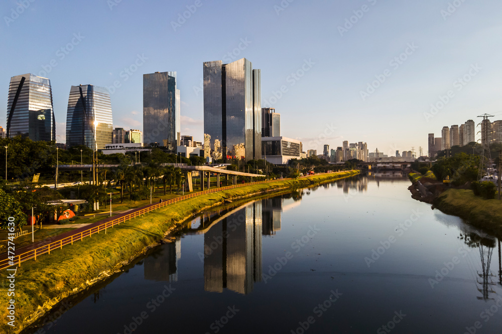 Naklejka premium Modern office buildings and Pinheiros River in Sao Paulo city, Brazil.