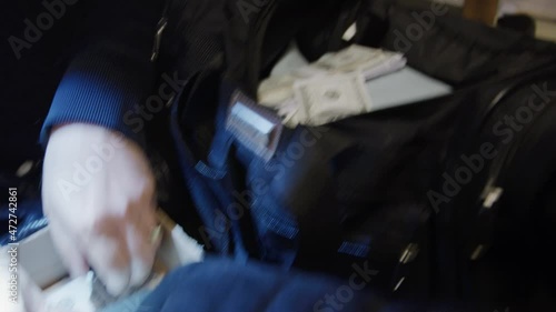 Heist quickly becoming rich money cash cashing in hands grabbing robbery bank robbers police stacks dollar bills greedy greed swat team gang movie fiction fantasy dreaming dream billionaire stash