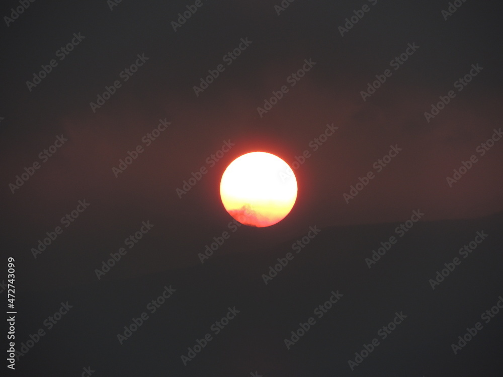 The red sun in the western sky The red sun in the western sky