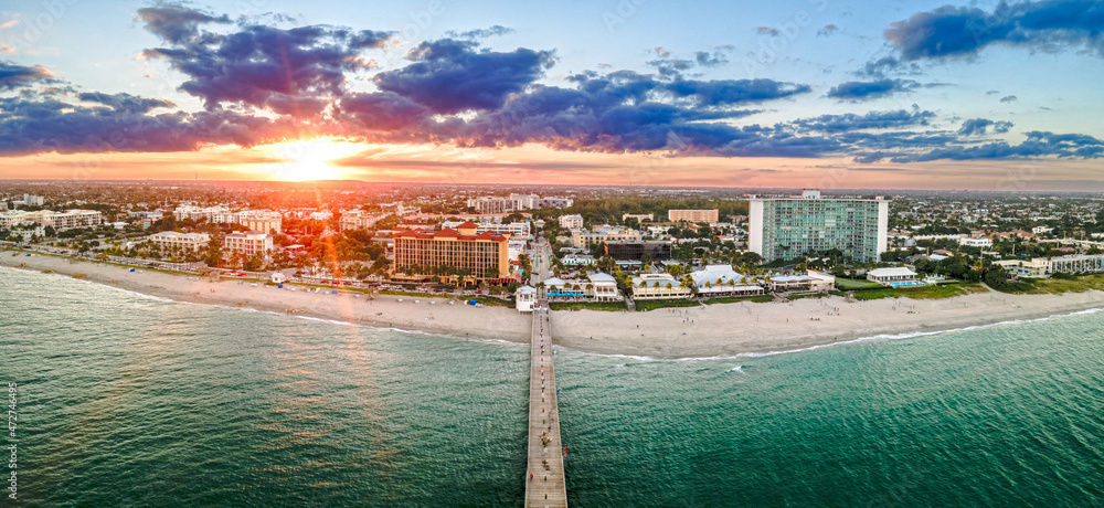 aerial drone of sunset over Deerfield Beach, Florida with city and beach