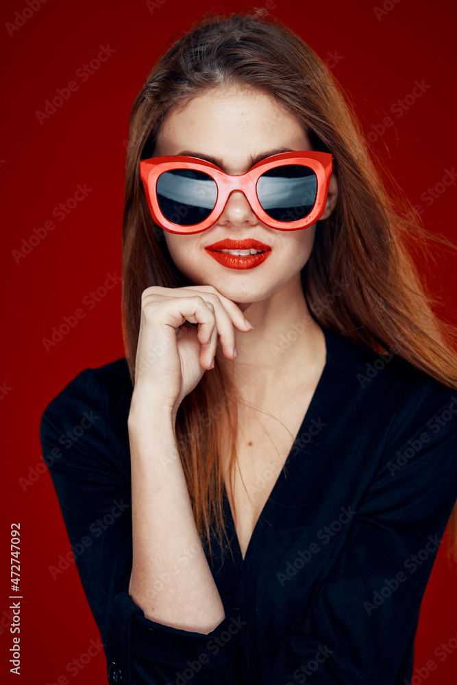 pretty woman wearing sunglasses fashion posing hairstyle red background pretty woman wearing sunglasses fashion posing hairstyle red background