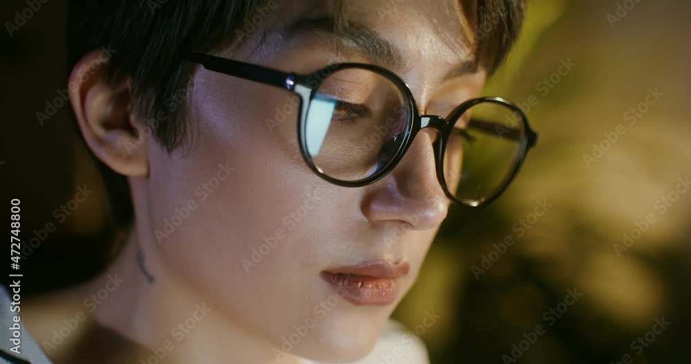 Close-up of a woman's face from the side on her neck a tattoo rare Close-up of a woman's face from the side on her neck a tattoo rare