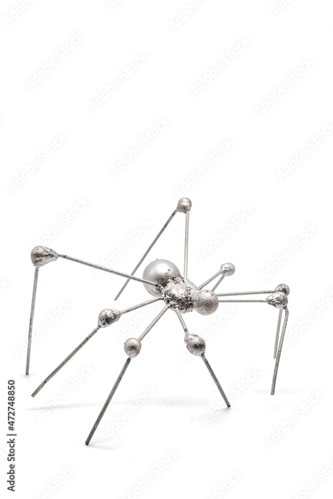 Isolated photos of a metal spider made of wire Isolated photos of a metal spider made of wire