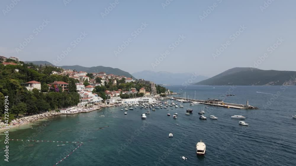 Herceg Novi Harbor, Montenegro. Drone Aerial View of Riviera and Hillside Town, Adriatic Sea and Kotor Bay Coastline Herceg Novi Harbor, Montenegro. Drone Aerial View of Riviera and Hillside Town, Adriatic Sea and Kotor Bay Coastline