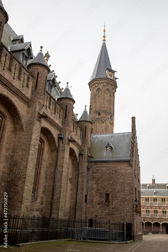 Fototapeta premium Europe, Netherlands, The Hague. Ridderzaal steeple towers over Binnenhof courtyard.