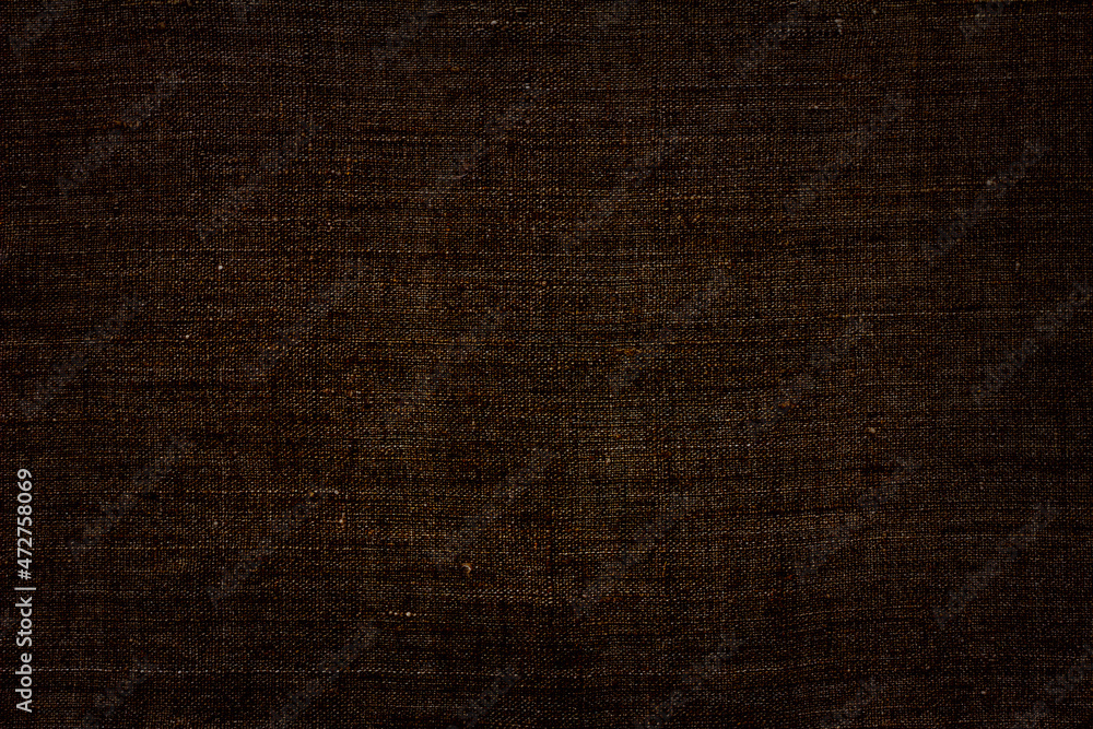 Natural linen fabric, background or texture, toned in brown color, top view, close up Natural linen fabric, background or texture, toned in brown color, top view, close up
