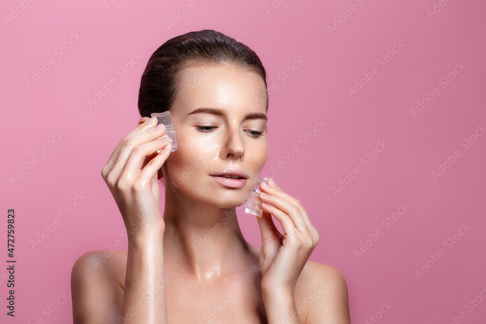 Beautiful young woman with healthy clean fresh skin applies Ice cubes on face. beauty treatments. Beautiful young woman with healthy clean fresh skin applies Ice cubes on face. beauty treatments.