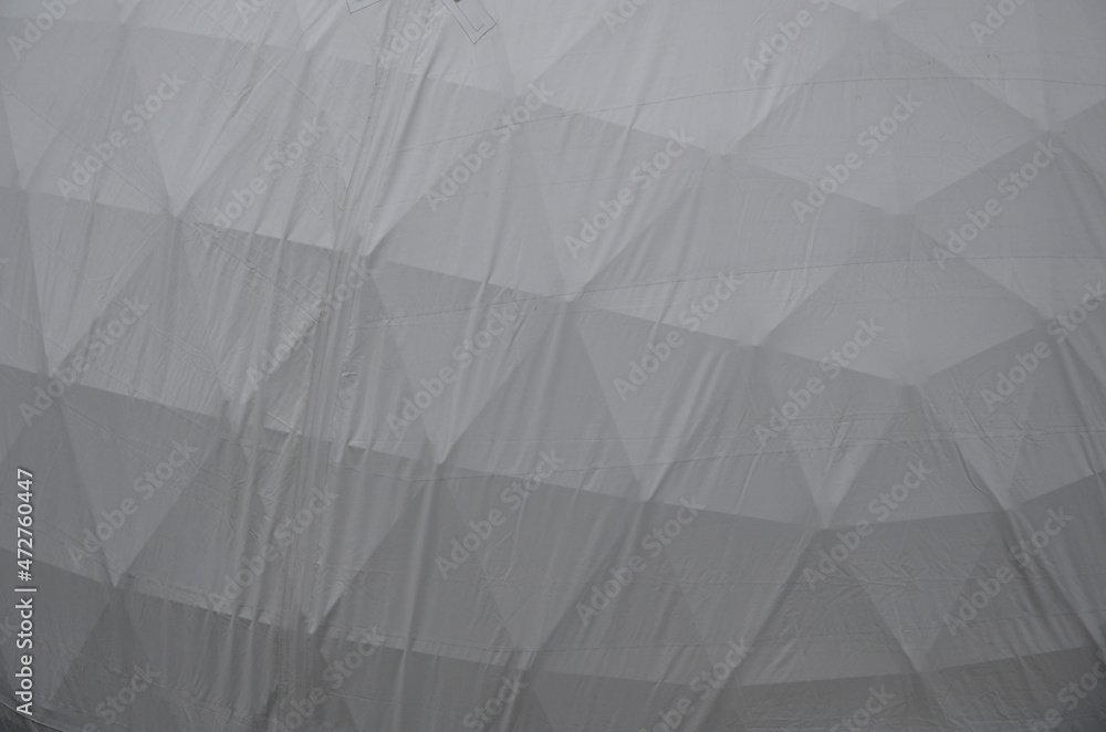 tent with hemispherical structure with triangle support frame. The white plastic is made of white plastic tarpaulin. The casing has holes for entry inside. research facility with its own atmosphere tent with hemispherical structure with triangle support frame. The white plastic is made of white plastic tarpaulin. The casing has holes for entry inside. research facility with its own atmosphere