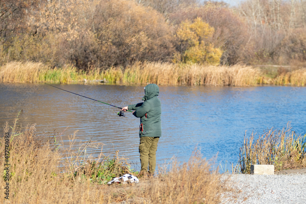 Fishing on the river, autumn nature.