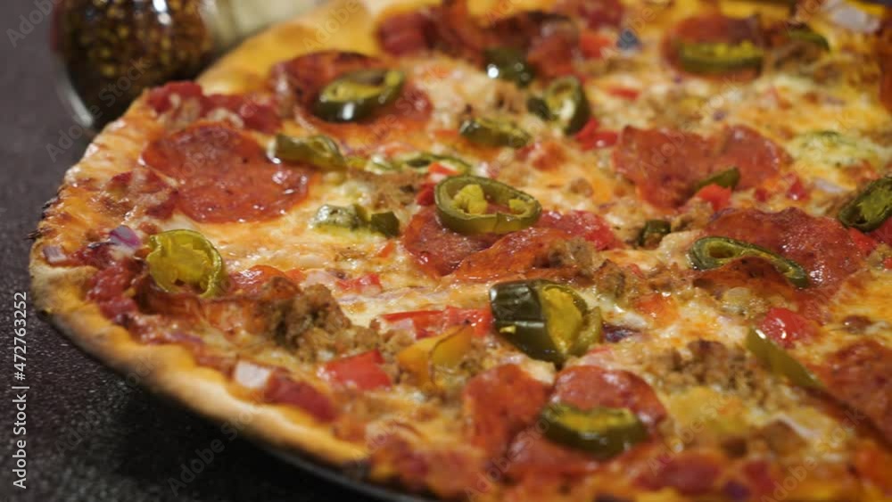 Classic thin crust pepperoni pizza with jalapenos, close up slider 4K Classic thin crust pepperoni pizza with jalapenos, close up slider 4K