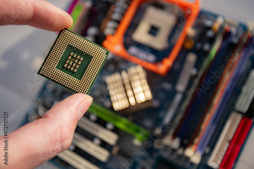 hand holding a computer chip