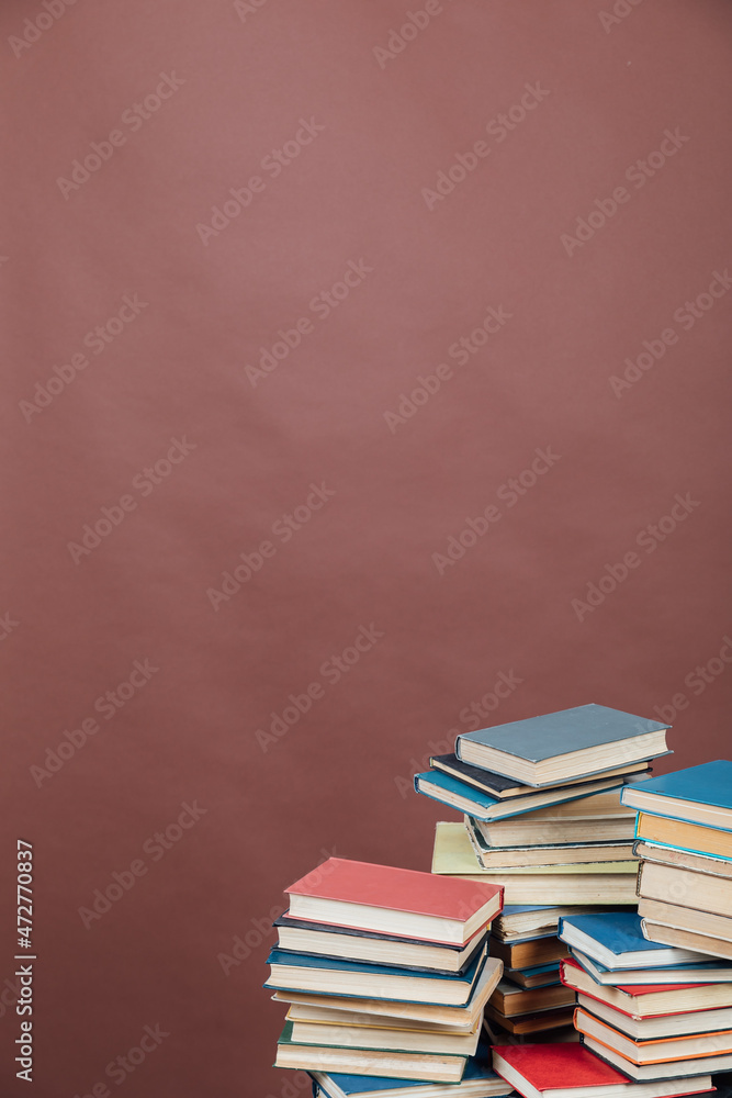 Fototapeta premium lots of books to study in the university library on a brown background
