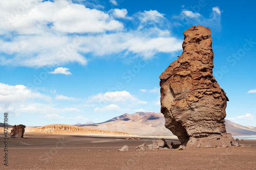 Chile, Atacama Desert, Los Flamencos National Reserve. Eroded volcanic structures called the Pacana Guardians dot the landscape.