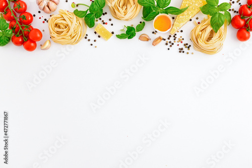 Obraz na plátně Iettuccine with ingredients for cooking Italian pasta on white background, top v