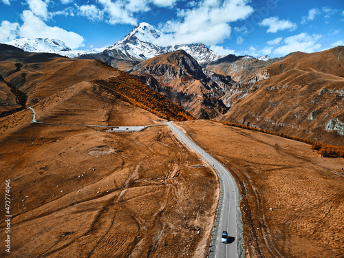 The road to the famous majestic Mount Kazbegi, the third highest peak in Georgia. Greater Caucasus. Stepantsminda, Gergeti