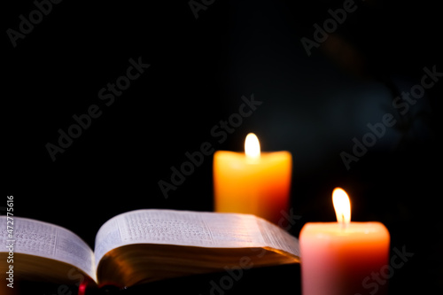 Bible, candle and holy cross
