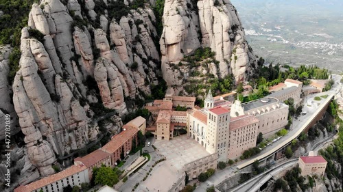 Drone shot of Mount Montserrat. Drone view of the famous Montserrat monastery.
Mountain shelter of Benedictine monks. The jagged mountains of Spain. Mountain landscape. Mountain trails.