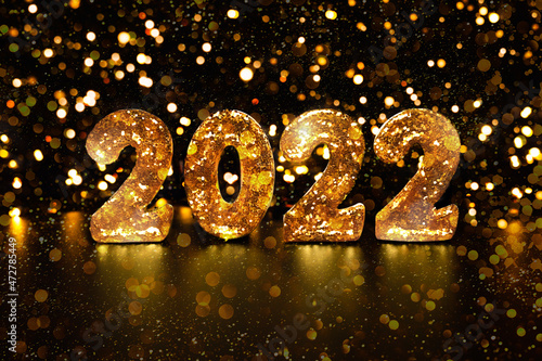 Holiday background 2022 New Year. Festive concept. Texture Gold glitter.