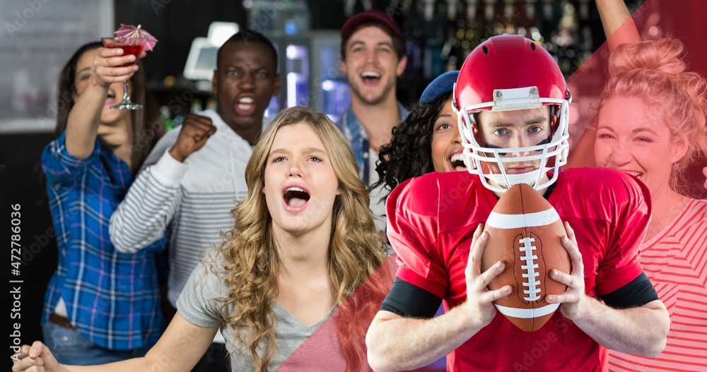Obraz premium Portrait of confident american football player holding ball with happy fans shouting