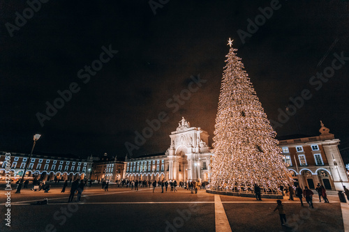 night new year city. a large Christmas tree illuminating a shopping area in Lisbon