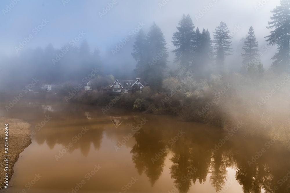 The fog clearing from the Russian River as the sun rises.