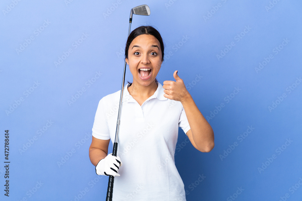 Young golfer woman over isolated colorful background giving a thumbs up gesture
