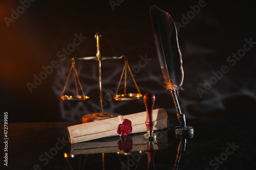 Photos Document with wax seal, scales and stamp in notary office