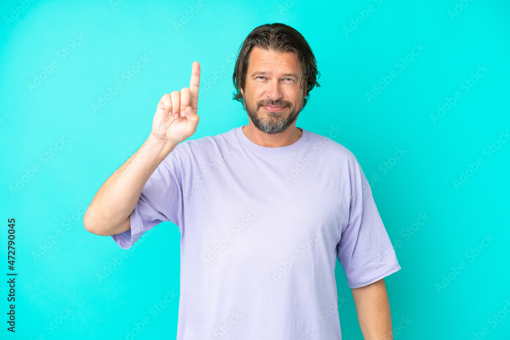 Senior dutch man isolated on blue background pointing up a great idea Senior dutch man isolated on blue background pointing up a great idea