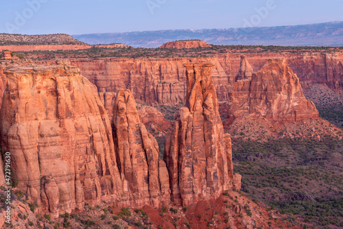 USA, Colorado. Colorado National Monument, sandstone towers rise from base of Monument Canyon at dawn, Monument Canyon Overlook.