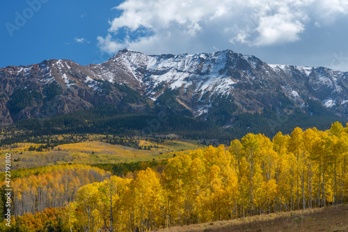 USA, Colorado. San Juan Mountains, Uncompahgre National Forest, Hayden Peak on the western edge of Sneffels Range above autumn colored aspen.
